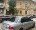 Сірий Міцубісі Lancer, об'ємом двигуна 1.58 л та пробігом 315 тис. км за 2350 $, фото 1 на Automoto.ua