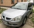 Сірий Міцубісі Lancer, об'ємом двигуна 1.58 л та пробігом 175 тис. км за 4150 $, фото 2 на Automoto.ua