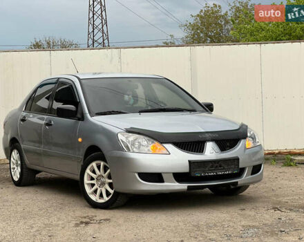 Сірий Міцубісі Lancer, об'ємом двигуна 1.6 л та пробігом 310 тис. км за 3350 $, фото 7 на Automoto.ua