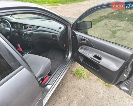 Сірий Міцубісі Lancer, об'ємом двигуна 1.6 л та пробігом 257 тис. км за 3700 $, фото 12 на Automoto.ua