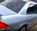 Серый Мицубиси Лансер, объемом двигателя 1.6 л и пробегом 250 тыс. км за 5000 $, фото 2 на Automoto.ua