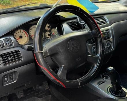 Серый Мицубиси Лансер, объемом двигателя 1.6 л и пробегом 196 тыс. км за 4390 $, фото 13 на Automoto.ua