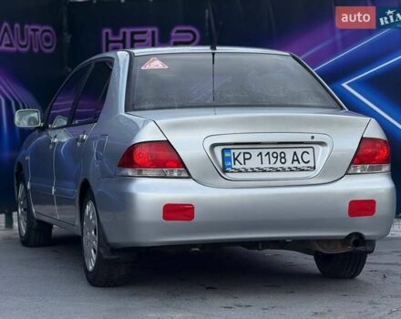 Сірий Міцубісі Lancer, об'ємом двигуна 1.58 л та пробігом 188 тис. км за 3799 $, фото 4 на Automoto.ua