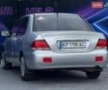 Сірий Міцубісі Lancer, об'ємом двигуна 1.58 л та пробігом 188 тис. км за 3799 $, фото 4 на Automoto.ua