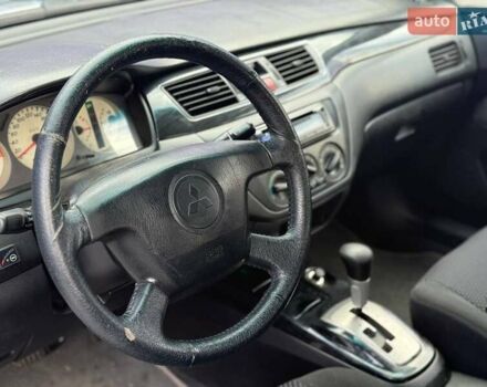 Сірий Міцубісі Lancer, об'ємом двигуна 1.58 л та пробігом 188 тис. км за 3799 $, фото 7 на Automoto.ua