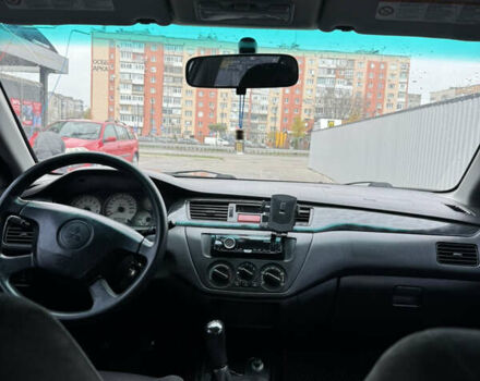 Серый Мицубиси Лансер, объемом двигателя 1.58 л и пробегом 260 тыс. км за 3500 $, фото 14 на Automoto.ua