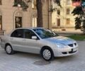 Серый Мицубиси Лансер, объемом двигателя 1.58 л и пробегом 250 тыс. км за 3750 $, фото 2 на Automoto.ua