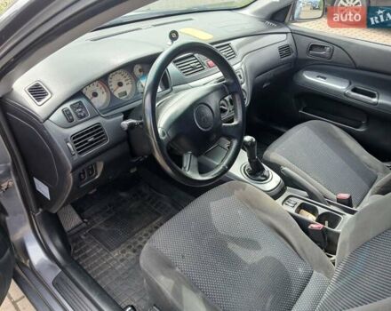 Сірий Міцубісі Lancer, об'ємом двигуна 1.58 л та пробігом 200 тис. км за 4000 $, фото 9 на Automoto.ua