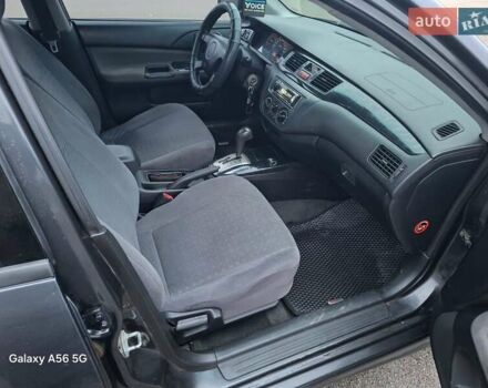 Серый Мицубиси Лансер, объемом двигателя 1.6 л и пробегом 305 тыс. км за 4000 $, фото 6 на Automoto.ua