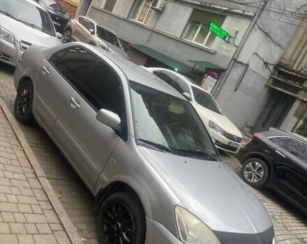 Сірий Міцубісі Lancer, об'ємом двигуна 1.58 л та пробігом 315 тис. км за 2350 $, фото 6 на Automoto.ua
