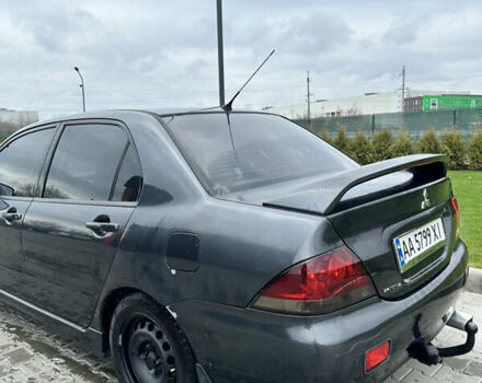 Серый Мицубиси Лансер, объемом двигателя 1.58 л и пробегом 300 тыс. км за 3500 $, фото 1 на Automoto.ua
