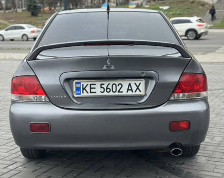 Серый Мицубиси Лансер, объемом двигателя 1.58 л и пробегом 237 тыс. км за 2999 $, фото 3 на Automoto.ua