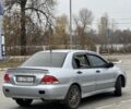 Серый Мицубиси Лансер, объемом двигателя 1.6 л и пробегом 250 тыс. км за 2600 $, фото 3 на Automoto.ua