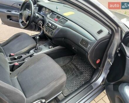 Сірий Міцубісі Lancer, об'ємом двигуна 1.58 л та пробігом 200 тис. км за 4000 $, фото 4 на Automoto.ua
