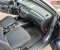 Сірий Міцубісі Lancer, об'ємом двигуна 1.58 л та пробігом 200 тис. км за 4000 $, фото 4 на Automoto.ua