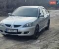 Серый Мицубиси Лансер, объемом двигателя 2 л и пробегом 240 тыс. км за 3950 $, фото 1 на Automoto.ua