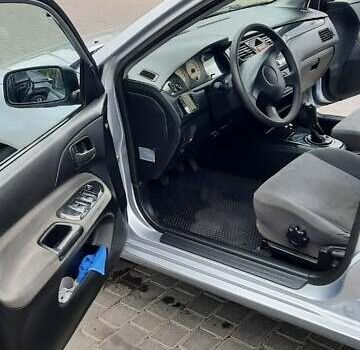 Серый Мицубиси Лансер, объемом двигателя 1.6 л и пробегом 277 тыс. км за 3500 $, фото 2 на Automoto.ua