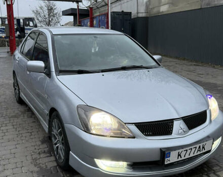 Серый Мицубиси Лансер, объемом двигателя 2 л и пробегом 256 тыс. км за 7000 $, фото 1 на Automoto.ua
