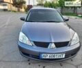 Сірий Міцубісі Lancer, об'ємом двигуна 1.6 л та пробігом 218 тис. км за 5700 $, фото 19 на Automoto.ua