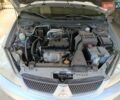 Сірий Міцубісі Lancer, об'ємом двигуна 1.58 л та пробігом 186 тис. км за 4300 $, фото 10 на Automoto.ua