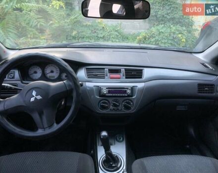 Сірий Міцубісі Lancer, об'ємом двигуна 1.58 л та пробігом 276 тис. км за 3650 $, фото 9 на Automoto.ua