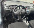 Сірий Міцубісі Lancer, об'ємом двигуна 1.58 л та пробігом 267 тис. км за 5300 $, фото 6 на Automoto.ua