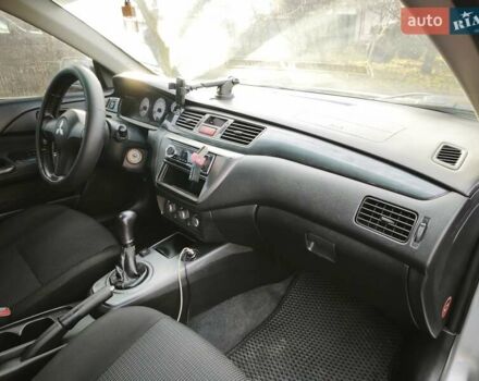 Серый Мицубиси Лансер, объемом двигателя 1.6 л и пробегом 234 тыс. км за 4300 $, фото 6 на Automoto.ua