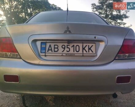 Серый Мицубиси Лансер, объемом двигателя 1.58 л и пробегом 250 тыс. км за 4700 $, фото 21 на Automoto.ua