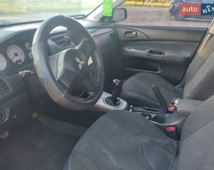 Серый Мицубиси Лансер, объемом двигателя 1.58 л и пробегом 250 тыс. км за 4700 $, фото 20 на Automoto.ua