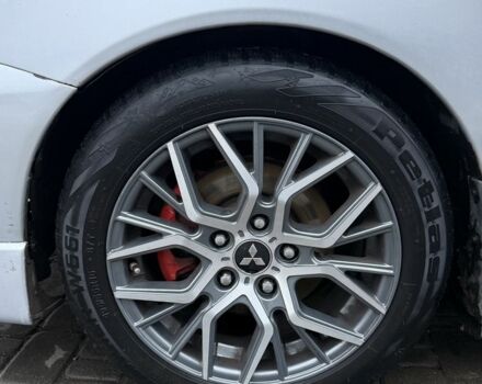 Серый Мицубиси Лансер, объемом двигателя 2 л и пробегом 256 тыс. км за 7000 $, фото 3 на Automoto.ua