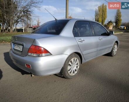 Серый Мицубиси Лансер, объемом двигателя 1.6 л и пробегом 344 тыс. км за 3400 $, фото 5 на Automoto.ua