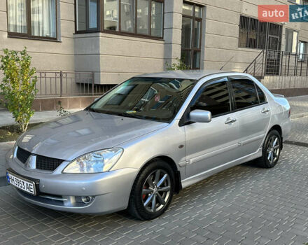 Серый Мицубиси Лансер, объемом двигателя 1.58 л и пробегом 244 тыс. км за 4950 $, фото 1 на Automoto.ua