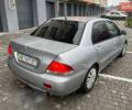 Сірий Міцубісі Lancer, об'ємом двигуна 1.58 л та пробігом 333 тис. км за 2999 $, фото 7 на Automoto.ua
