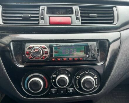 Серый Мицубиси Лансер, объемом двигателя 1.6 л и пробегом 333 тыс. км за 2800 $, фото 11 на Automoto.ua