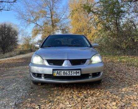 Серый Мицубиси Лансер, объемом двигателя 1.6 л и пробегом 204 тыс. км за 3999 $, фото 1 на Automoto.ua