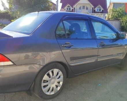 Сірий Міцубісі Lancer, об'ємом двигуна 1.6 л та пробігом 229 тис. км за 4900 $, фото 18 на Automoto.ua