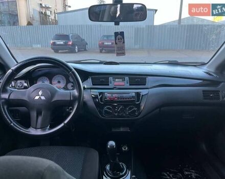 Серый Мицубиси Лансер, объемом двигателя 1.6 л и пробегом 279 тыс. км за 3990 $, фото 9 на Automoto.ua