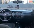 Серый Мицубиси Лансер, объемом двигателя 1.6 л и пробегом 279 тыс. км за 3990 $, фото 9 на Automoto.ua