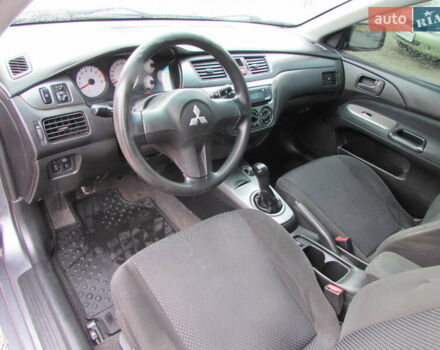 Серый Мицубиси Лансер, объемом двигателя 1.58 л и пробегом 300 тыс. км за 3600 $, фото 5 на Automoto.ua