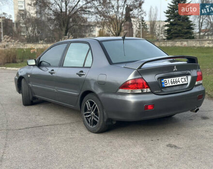 Сірий Міцубісі Lancer, об'ємом двигуна 1.58 л та пробігом 332 тис. км за 4650 $, фото 3 на Automoto.ua