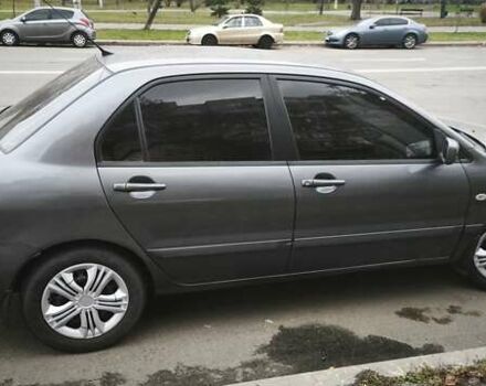 Серый Мицубиси Лансер, объемом двигателя 1.6 л и пробегом 263 тыс. км за 3650 $, фото 9 на Automoto.ua