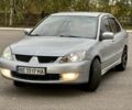 Серый Мицубиси Лансер, объемом двигателя 1.6 л и пробегом 230 тыс. км за 4450 $, фото 6 на Automoto.ua