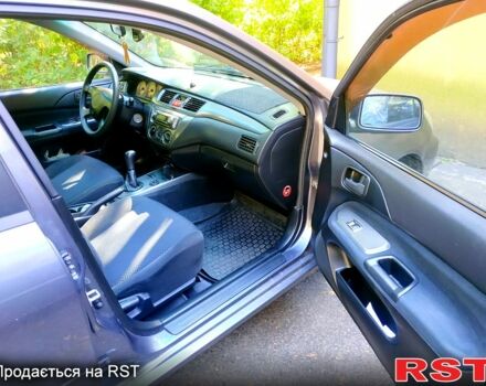 Серый Мицубиси Лансер, объемом двигателя 1.6 л и пробегом 177 тыс. км за 4000 $, фото 3 на Automoto.ua