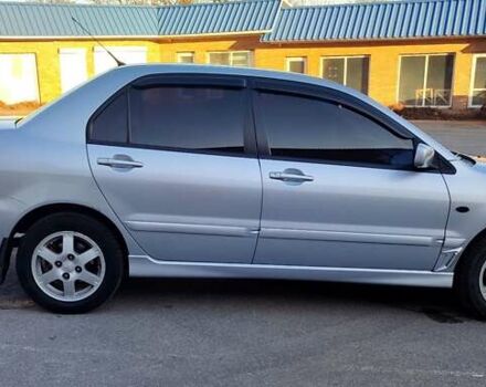 Сірий Міцубісі Lancer, об'ємом двигуна 1.58 л та пробігом 207 тис. км за 4300 $, фото 3 на Automoto.ua