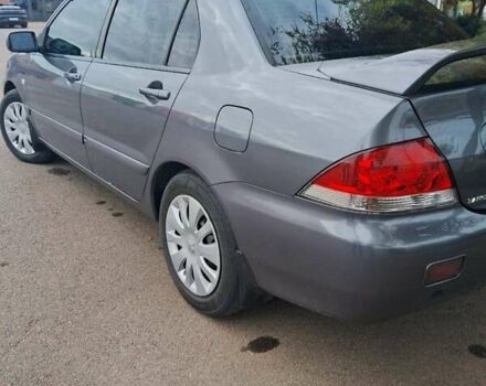 Сірий Міцубісі Lancer, об'ємом двигуна 1.6 л та пробігом 229 тис. км за 4900 $, фото 22 на Automoto.ua