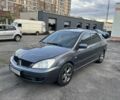 Серый Мицубиси Лансер, объемом двигателя 1.6 л и пробегом 250 тыс. км за 3399 $, фото 1 на Automoto.ua