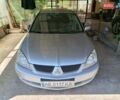 Сірий Міцубісі Lancer, об'ємом двигуна 1.58 л та пробігом 186 тис. км за 4300 $, фото 11 на Automoto.ua