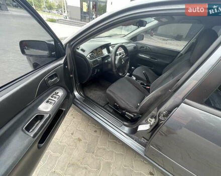 Сірий Міцубісі Lancer, об'ємом двигуна 1.58 л та пробігом 162 тис. км за 4650 $, фото 9 на Automoto.ua
