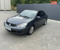 Сірий Міцубісі Lancer, об'ємом двигуна 1.58 л та пробігом 162 тис. км за 4650 $, фото 1 на Automoto.ua
