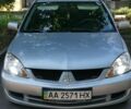 Сірий Міцубісі Lancer, об'ємом двигуна 1.58 л та пробігом 241 тис. км за 3500 $, фото 1 на Automoto.ua